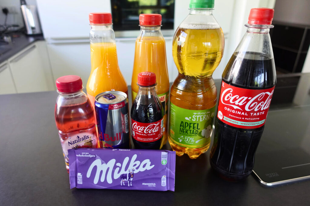 Zucker,Getränke,Schokolade,Apfelsaft,Osaft,Cola,viel,nebeneindander